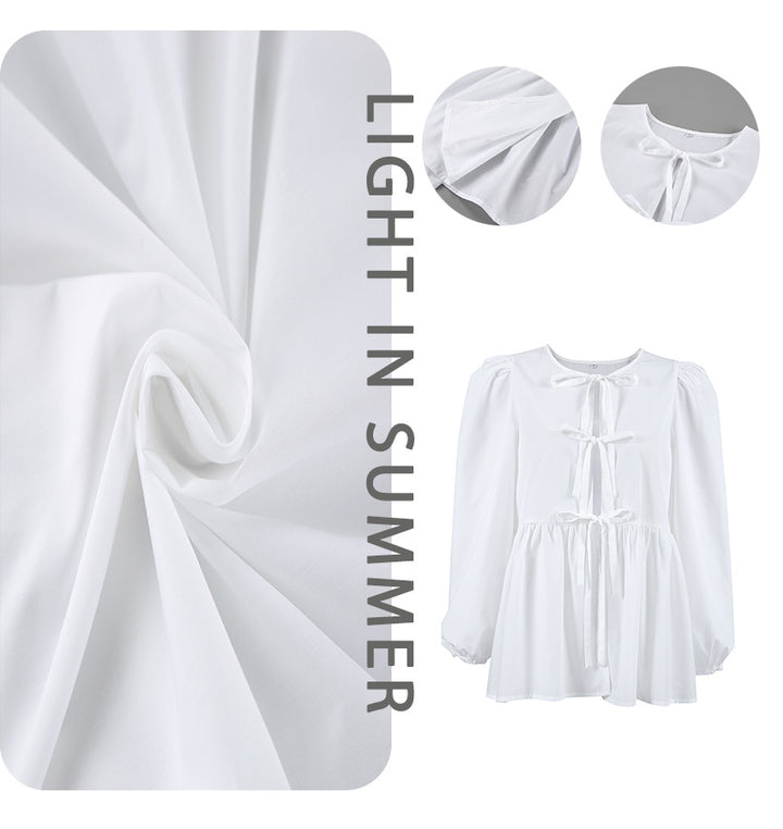 Damebluse med draperinger og dekorative sløjfer Stilla