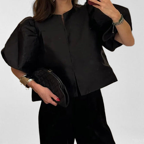 Damebluse med voluminøse puffærmer og moderne design Skovae