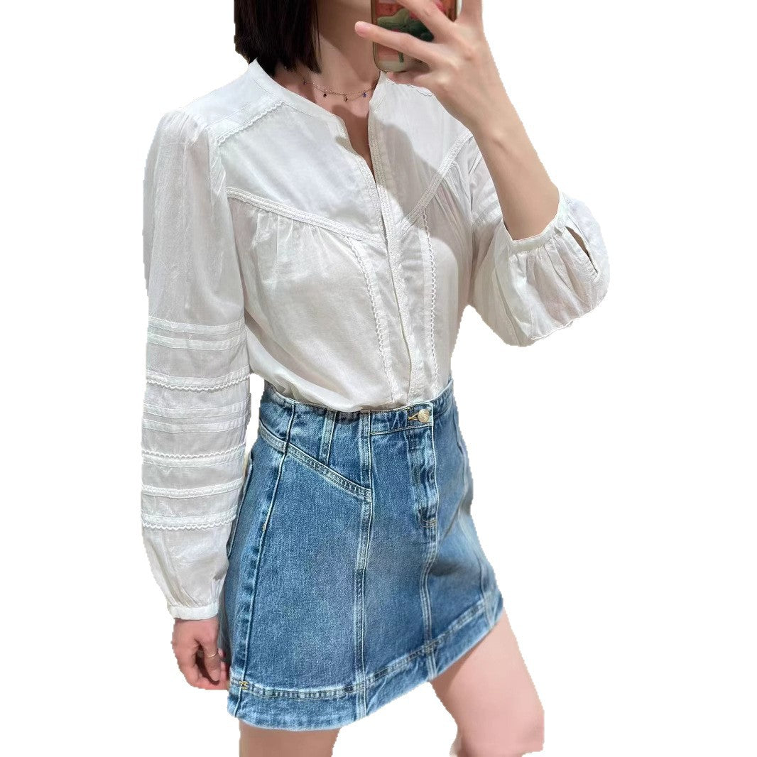 Damebluse med elegante detaljer og broderede accenter Stilla