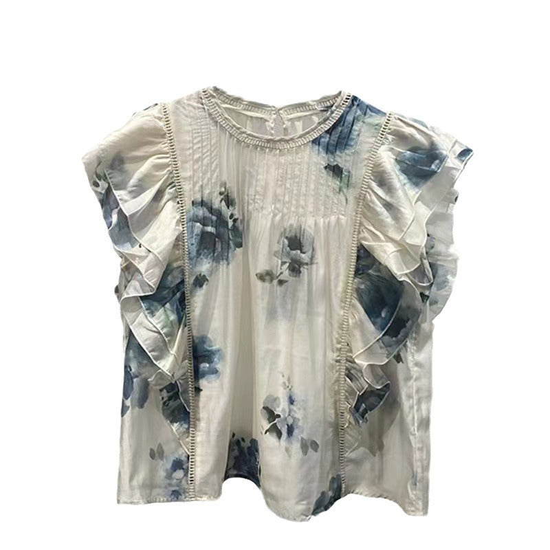 Damebluse med overdådige flæsedetaljer og sarte blomsterdesign Stilla