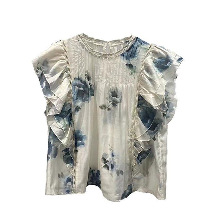 Damebluse med overdådige flæsedetaljer og sarte blomsterdesign Stilla