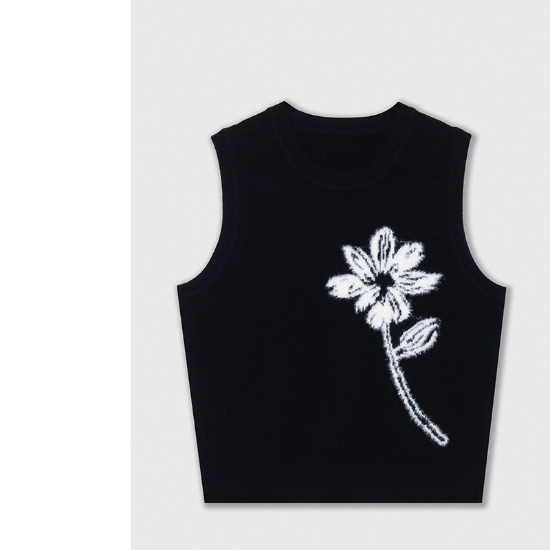 Dame strikvest med blomstermotiv og elegant krave Stilla