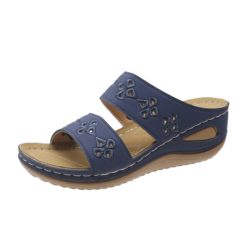 Dame Wedge-Pantoletten med floralt cut-out-design og ergonomisk sål Stilla