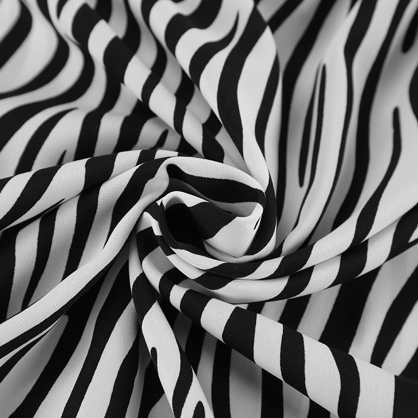 Damebluse med zebra-print og moderne snit Stilla