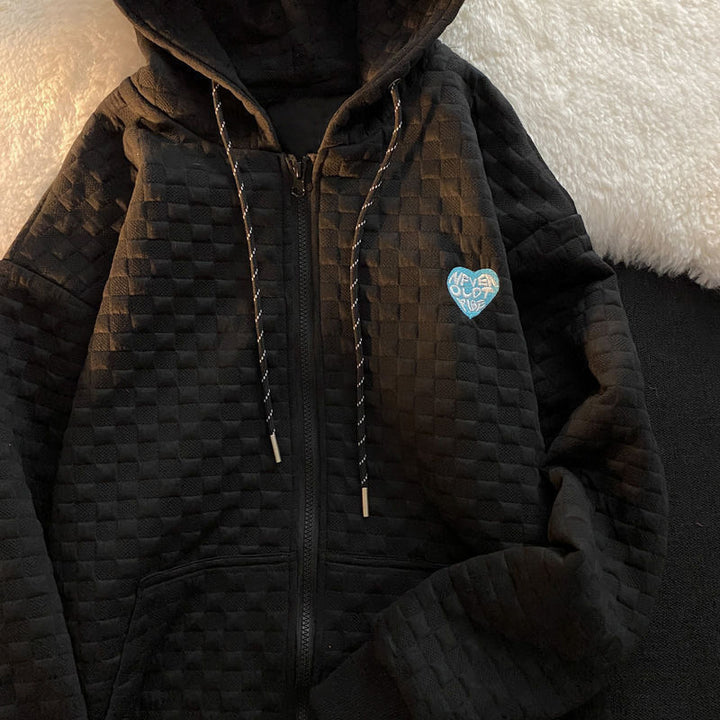 Dame hoodie jakke lavet af struktureret materiale med praktiske lommer og fashionable design