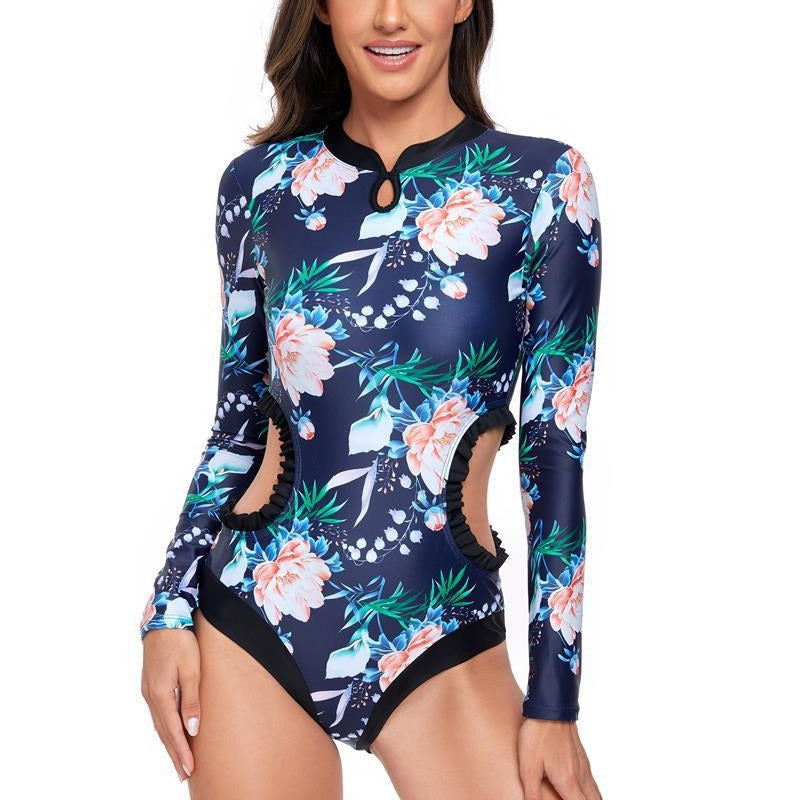 Dame elegant one-piece surfedragt med blomstermønster og cut-out-detaljer Stilla