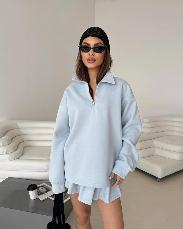 Dame sporty oversized pullover med kort lynlås og ribbede detaljer Skovae