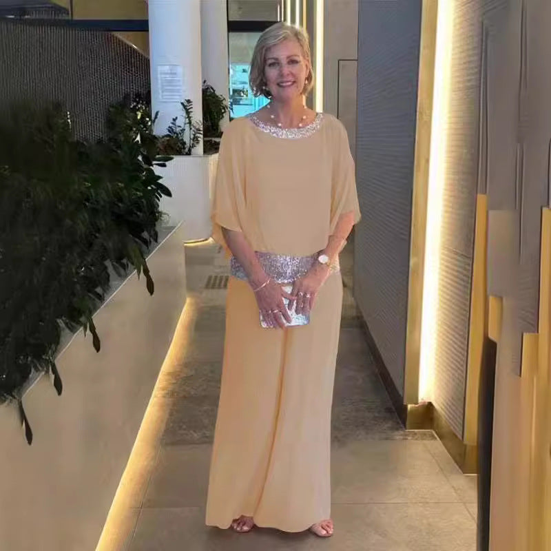 Dame elegant jumpsuit med flydende overdel og glitrende taljebånd Stiila
