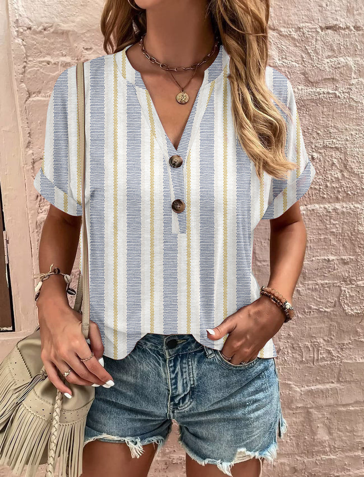 Damebluse med blomsterdesign og knaplukning Stilla