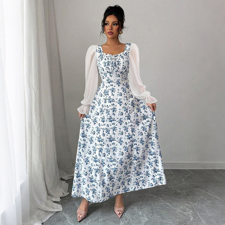 Dame Maxikjole med transparente pufærmer og blomsterdesign Stilla