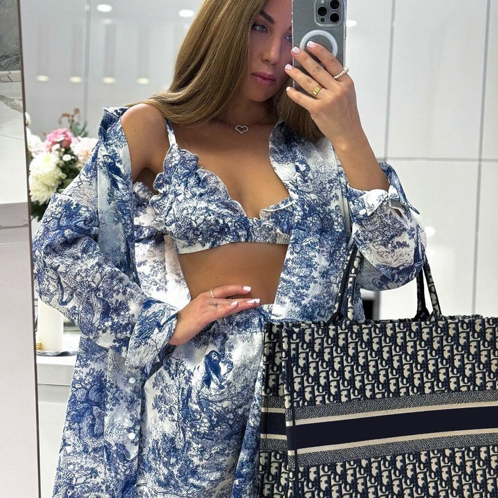 Dame top og nederdel ensemble med raffinerede flæsedetaljer og blomstret tryk Stilla