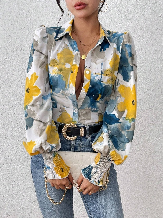 Dame elegant bluse med farverigt floralt design og afslappede puffærmer Stilla