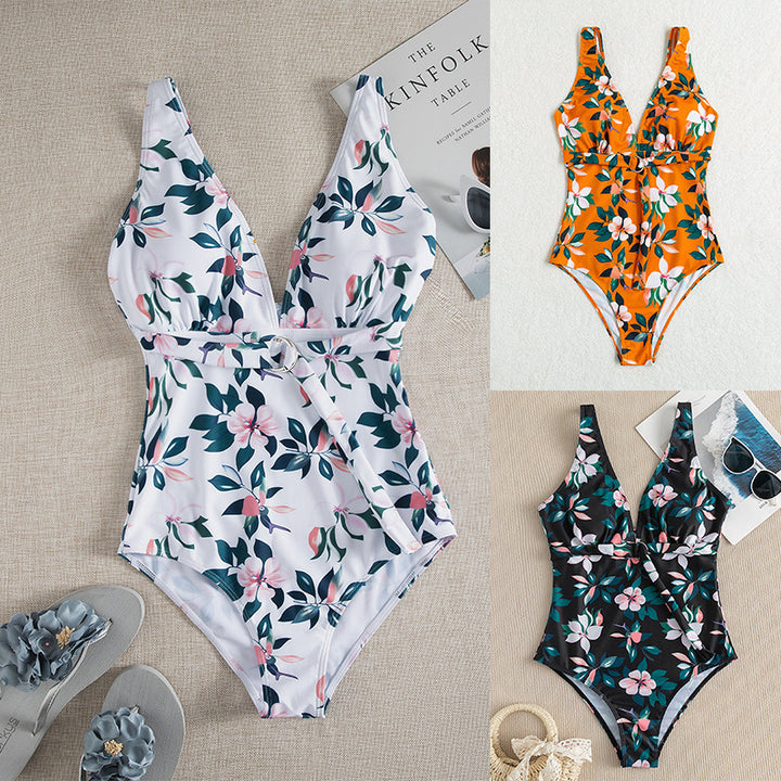 Dame én-delt badedragt med elegant snøre detaljer og floralt design Stilla