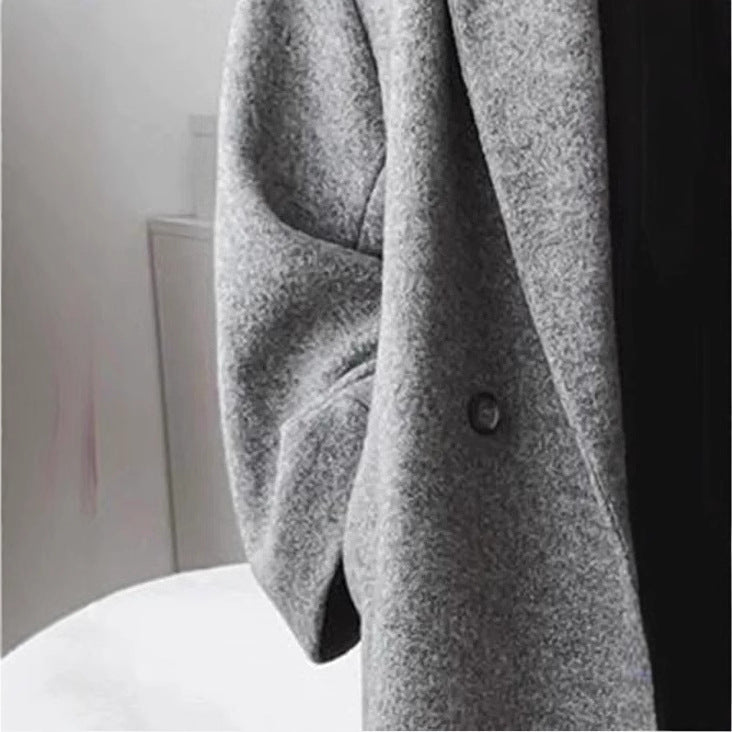 Kvinders oversized uldfrakke med dobbelt knaplukning og elegant snit Stilla