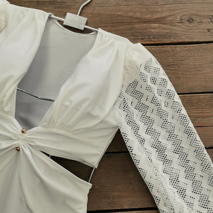 Dame one-piece badedragt med elegante spidse ærmer og raffineret indpakningsdesign Stilla
