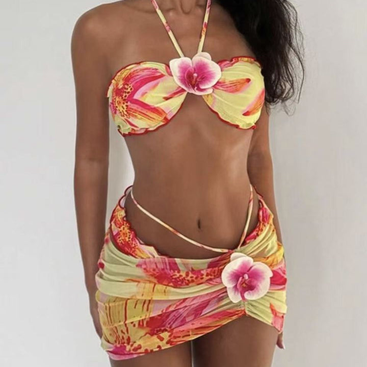 Dame bikini-sæt med floralt design og legesyg omslagsskjørt Skovae