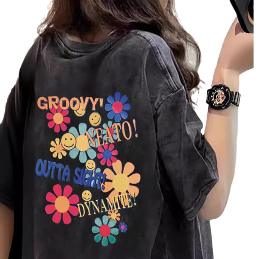 Dame T-shirt med kreativt blomster- og smiley-design Stilla