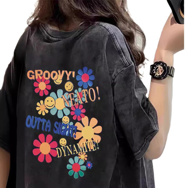 Dame T-shirt med kreativt blomster- og smiley-design Stilla