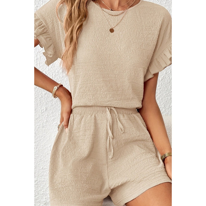 Dame kortærmet jumpsuit med flæse detaljer og bindebælte Skovae
