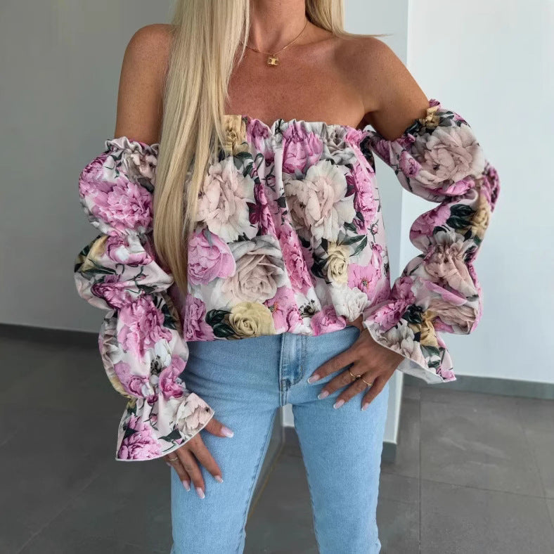 Damebluse med voluminøse rynkede ærmer og blomstret tryk Stilla