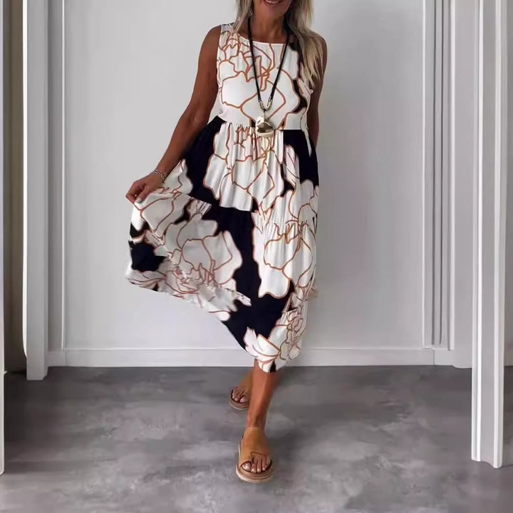 Dame Midikjole med asymmetrisk kant og blomstret print Stilla