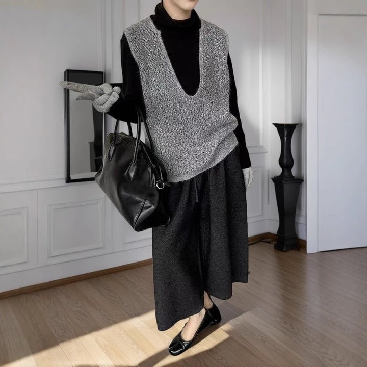 Dame fashionable strikket vest med dyb V-hals og kreativ skæring Stilla