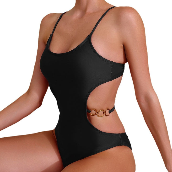 Dame ét parter badedragt med stilfulde cut-outs og elegante gulddetaljer Stilla