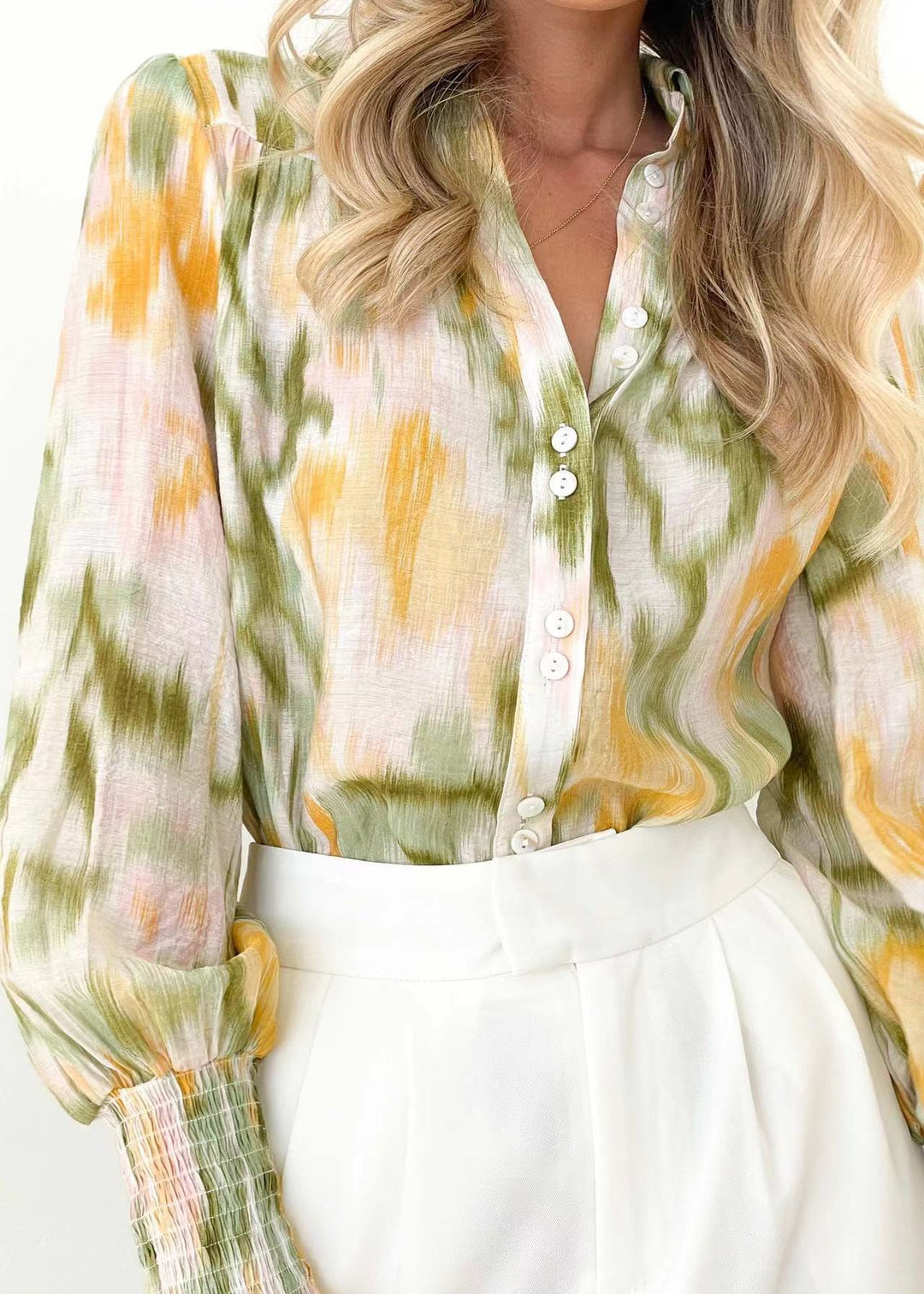 Damebluse med elegant farveovergang og trendy pufærmer Stilla