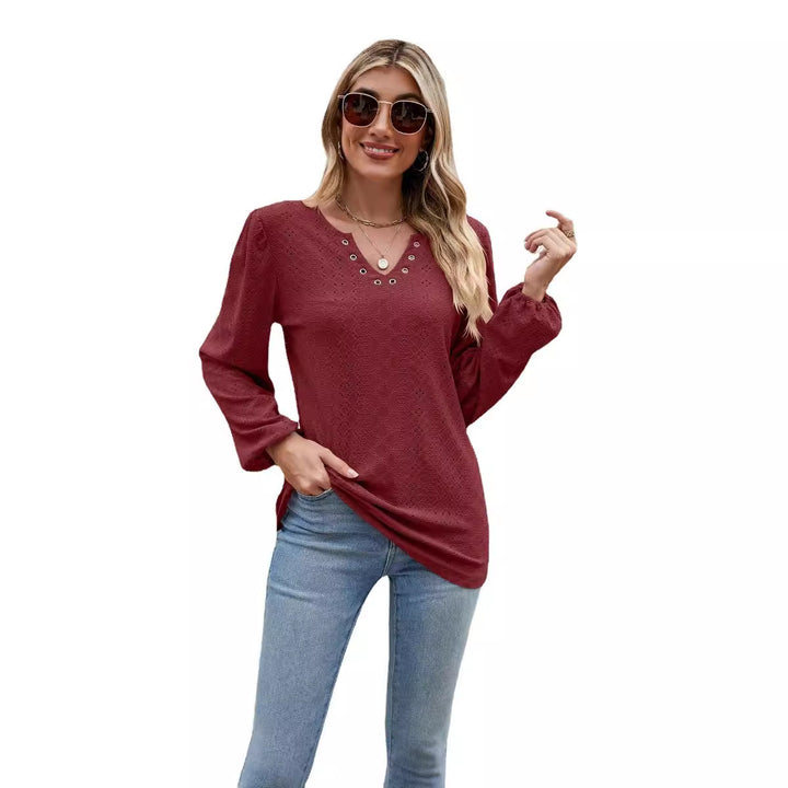 Damebluse med elegant spidsstruktur og V-hals Stilla