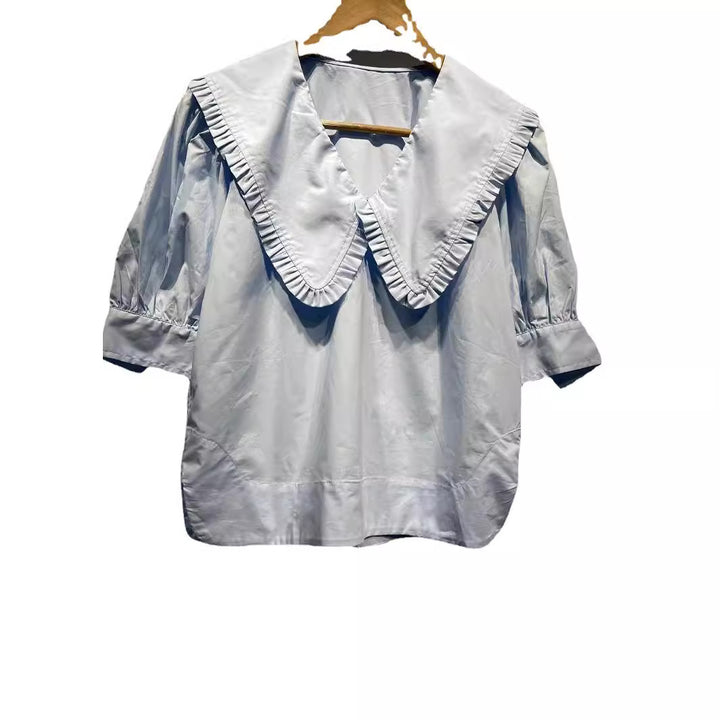 Damebluse med voluminøs krave og flæsedetaljer Stilla