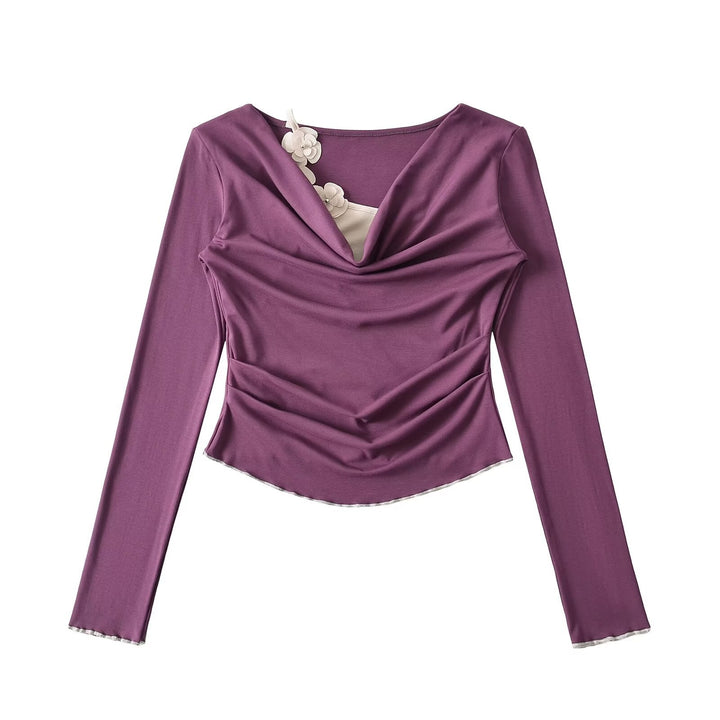 Dame elegant langærmet top med raffinerede draperingsdetaljer og blomsterakcent Stilla