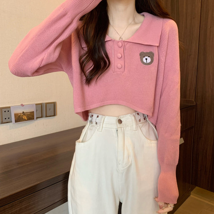 Kvinder Cropped Pullover med en knaplukning og unicorn emblem