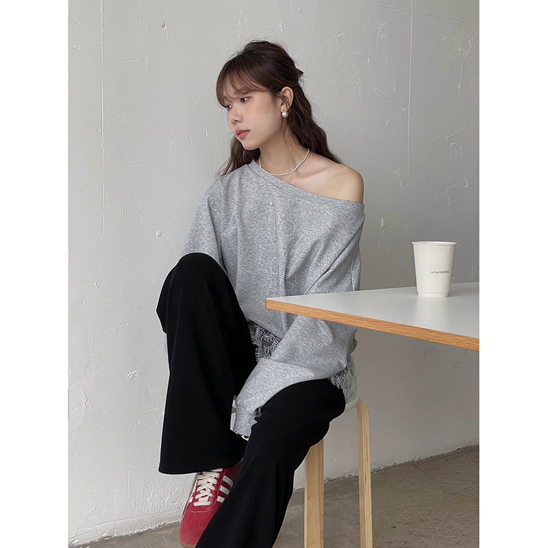 Dame afslappet sweatshirt med trendy asymmetrisk design og dekorative rhinestone-detaljer Stilla