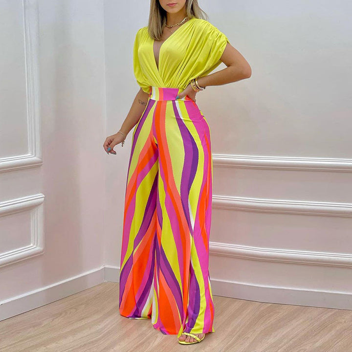 Damer Elegant Jumpsuit med Dyb V-Hals og Bred Skåret Ben Stilla