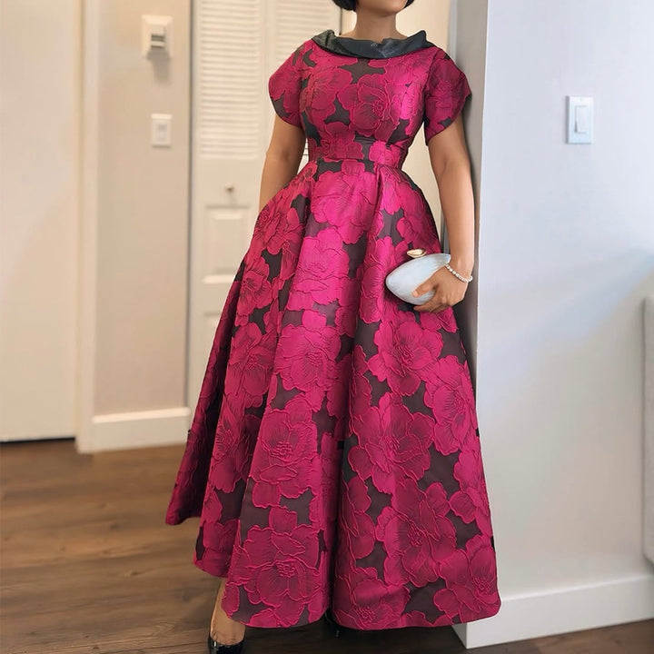 Damer Elegante Midikjole med floral design og struktureret overdel Skovae