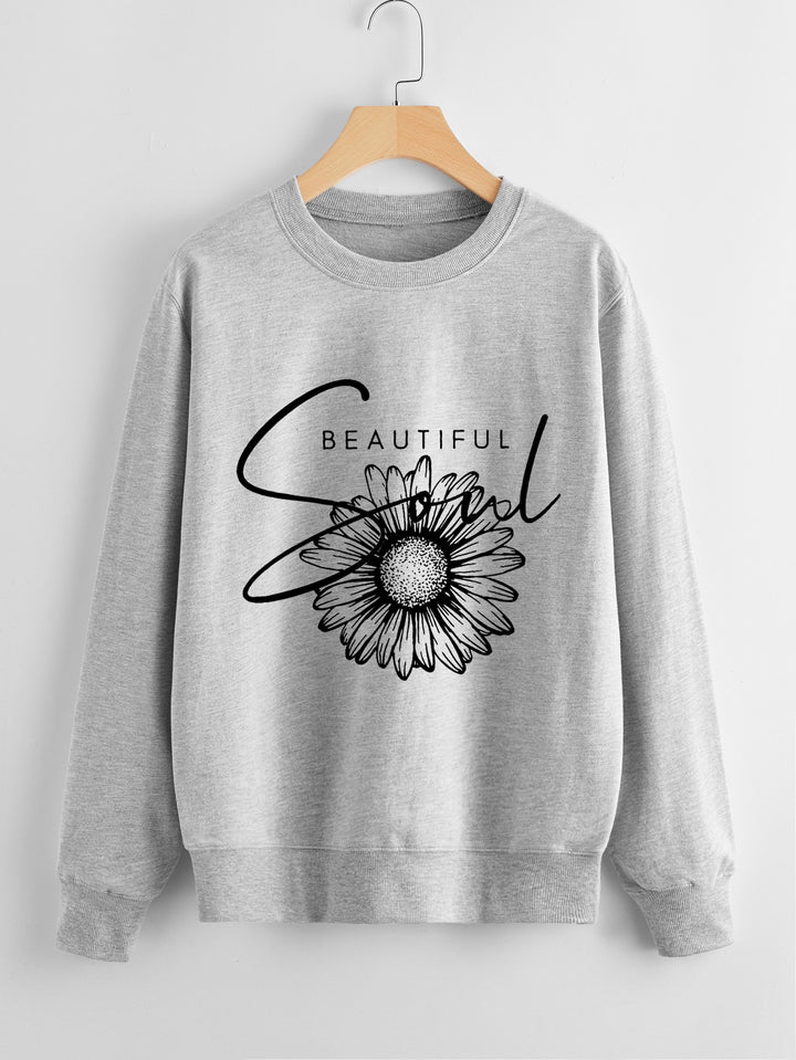 Kvindes sweatshirt med blomstermotiv og inspirerende tekst Stilla