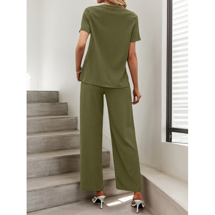 Dame kortærmet jumpsuit med flæse detaljer og bindebælte Skovae