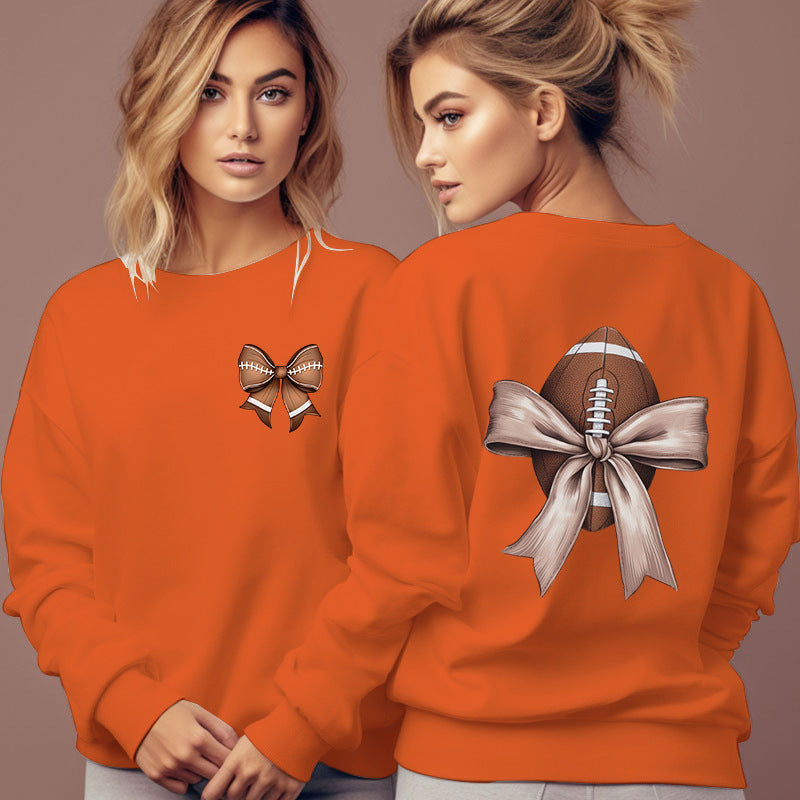 Dame sweatshirt med sødt fodboldmotiv og sløjfeaccent Stilla