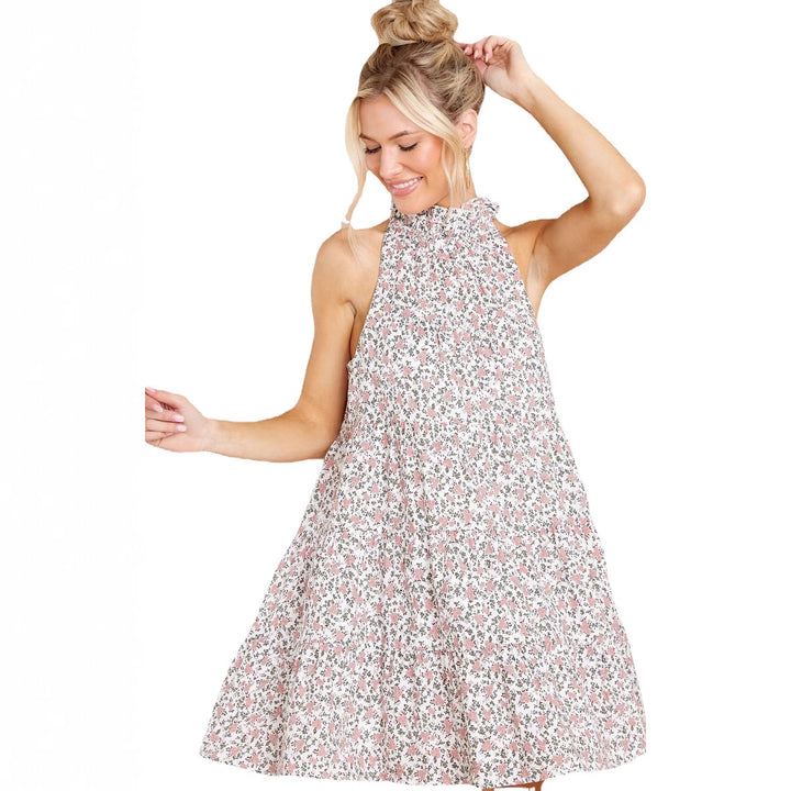Women's halter dress with playful floral design and ruffle details
