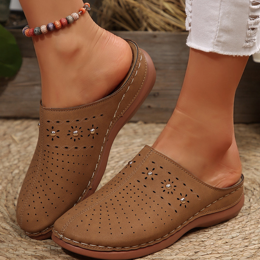Dame Komfortable Clogs med fashionable perforeringsdesign og dekorative accenter Stilla