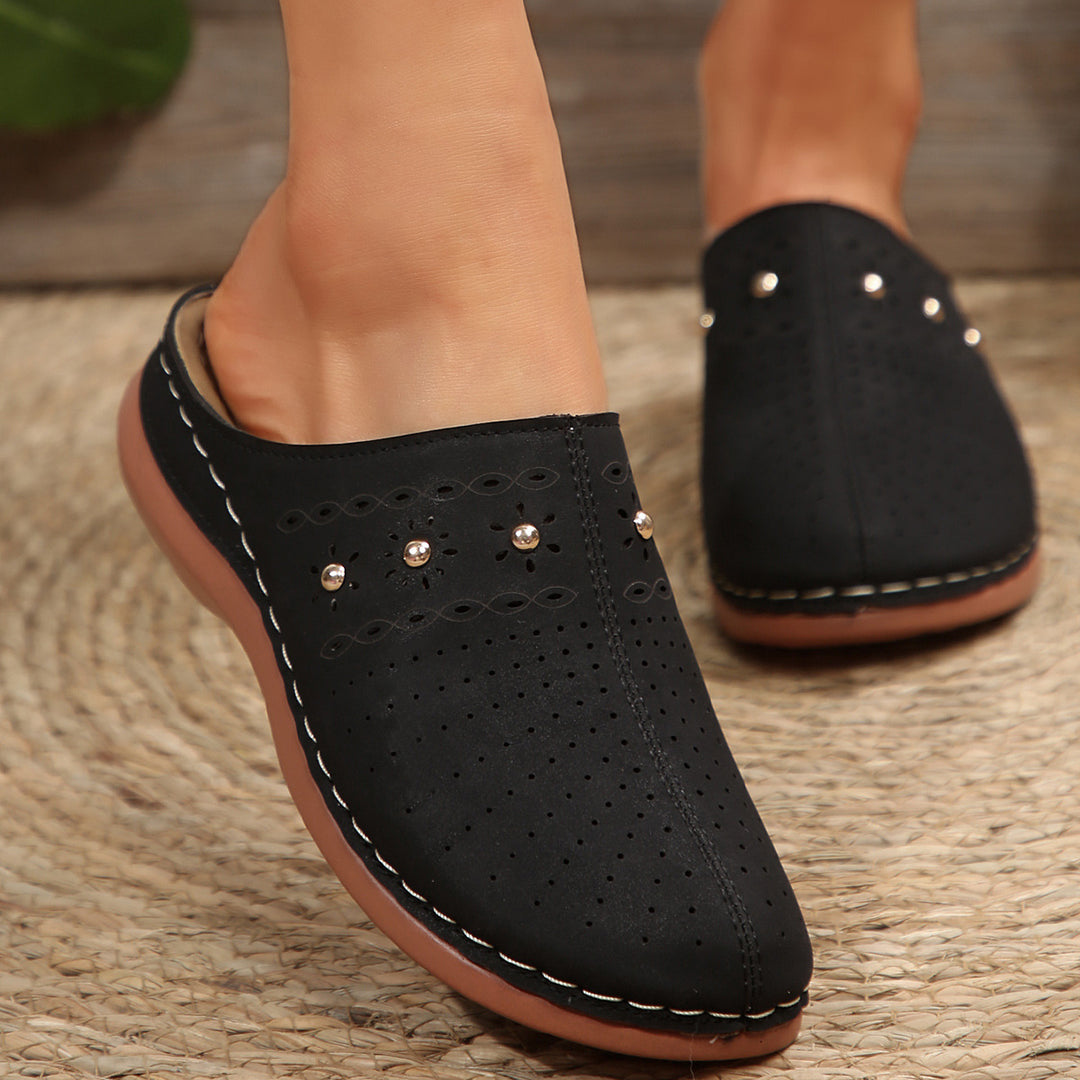 Dame Komfortable Clogs med fashionable perforeringsdesign og dekorative accenter Stilla