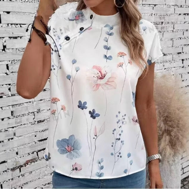 Damebluse med florale accenter og knapdetaljer Stilla