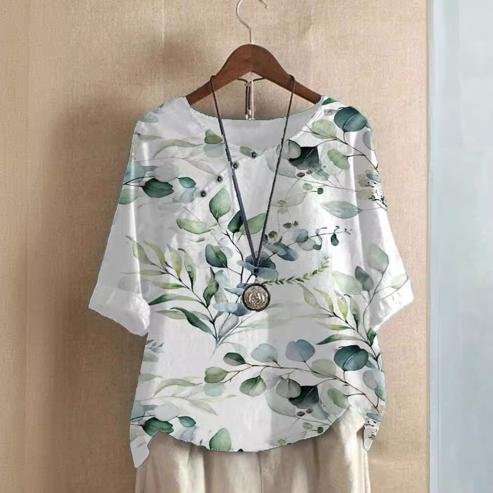 Damer bomuldsbluse med blomstertryk og elegant knaplukning Stilla