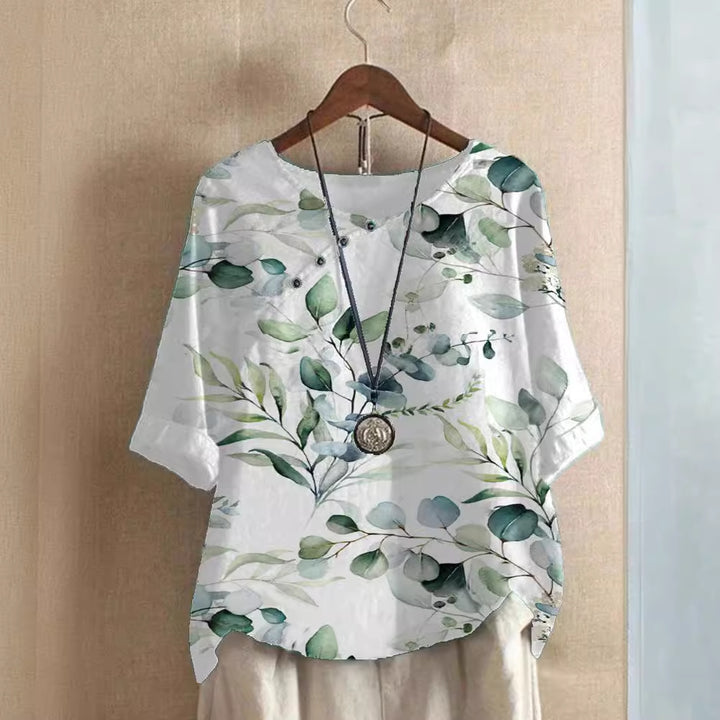 Damer bomuldsbluse med blomstertryk og elegant knaplukning Stilla