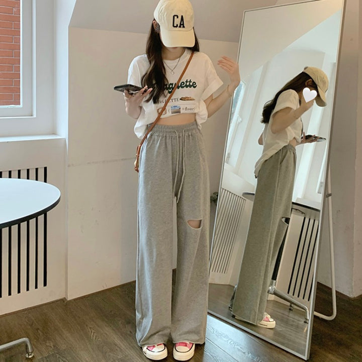 Kvinders casual brede sweatpants med fashionable udskæring og elastisk talje.