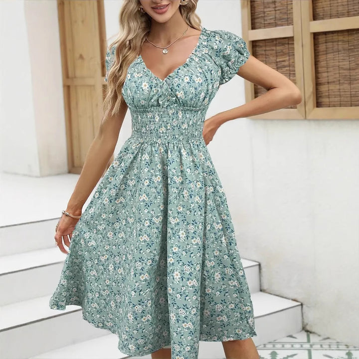Dame Floral Midi-Kjole med elastisk Talje og Puffærmer Stilla
