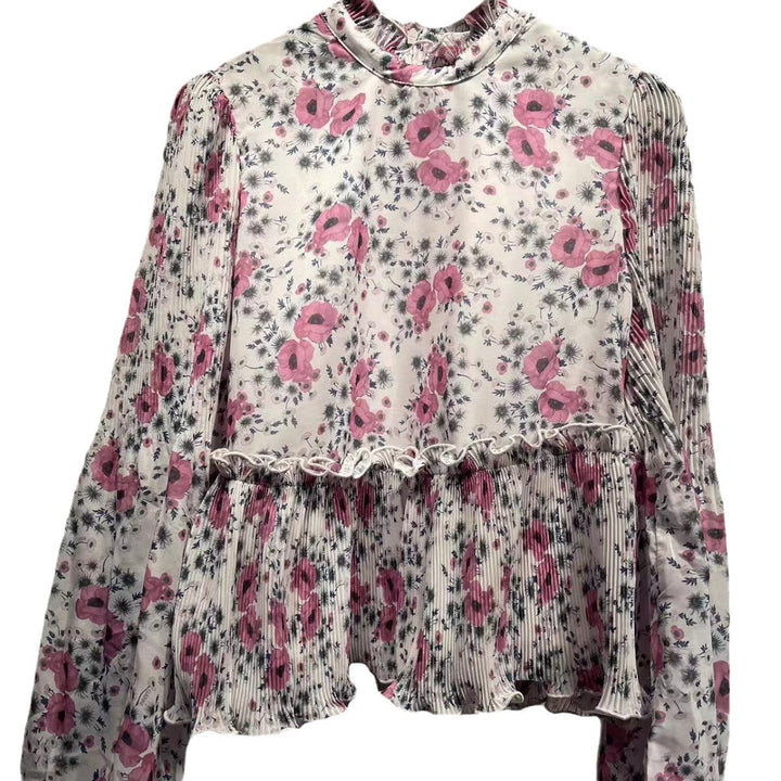 Damebluse med blomsterdesign og elegante plisséærmer Stilla