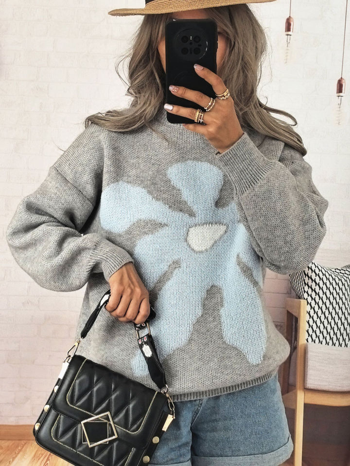 Kvinders afslappede strikket sweater med farverigt blomster mønster og sænkede skuldre Stilla
