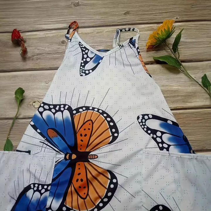 Dame jumpsuit med iøjnefaldende sommerfugledesign og praktiske lommer Stilla