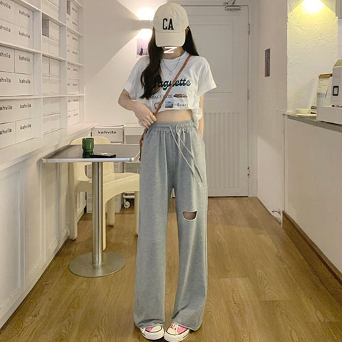 Kvinders casual brede sweatpants med fashionable udskæring og elastisk talje.
